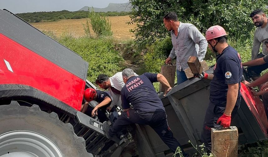 Adana'da devrilen biçerdöverin altında sıkışan sürücüsü kurtarıldı